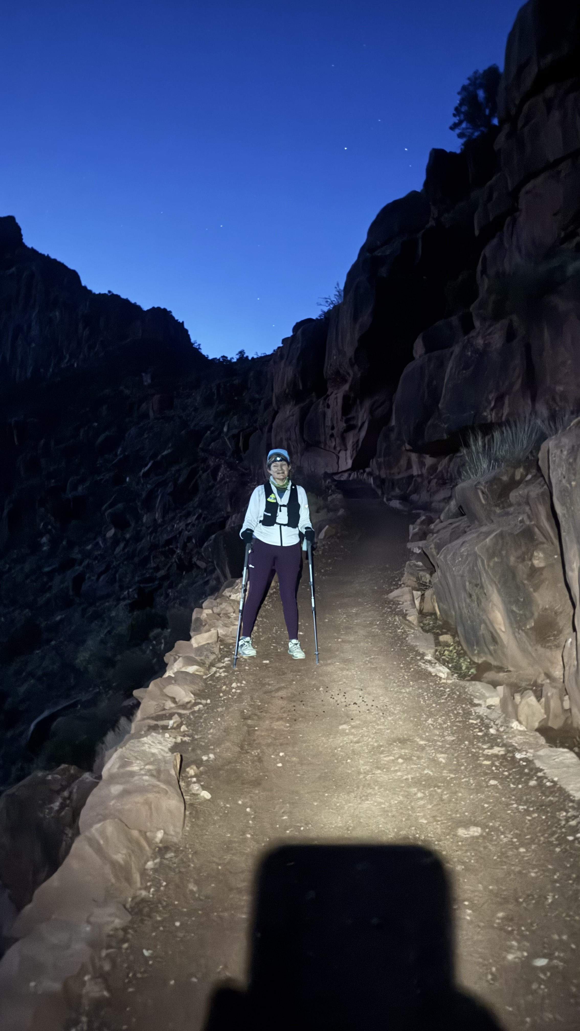 Night hiking with headlamp under stars at Grand Canyon